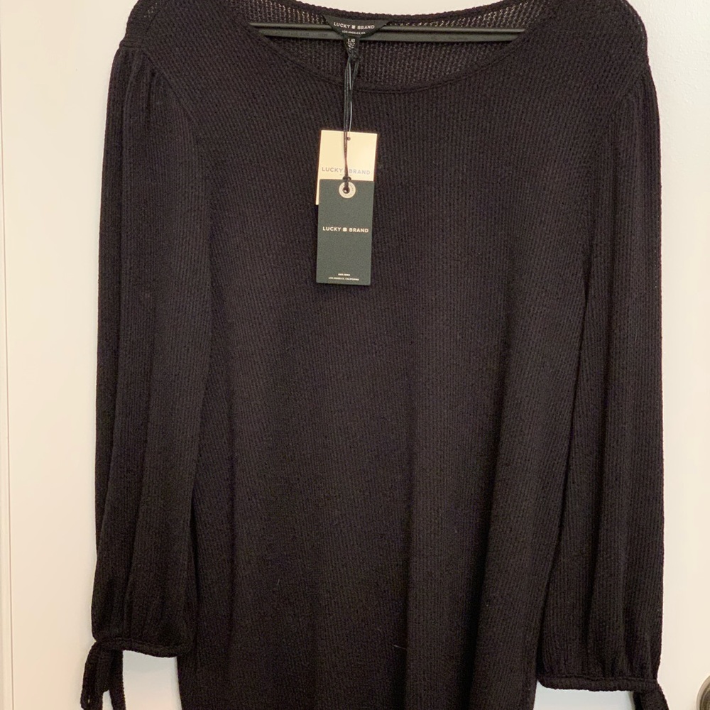 A stylish, black, lightweight sweater is adorable. Perfect with a skirt/pants.